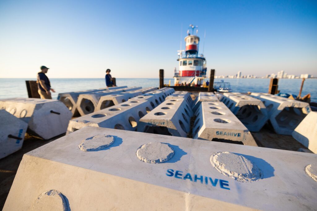 SEAHIVE pieces that are part of artificial reef structures off Miami Beach wait to be offloaded into the ocean in 2023 as part of a two-year project called ECoREEF (Engineering Coastal Resilience Through Hybrid Reef Restoration). (Photo by Joshua Prezant/University of Miami)