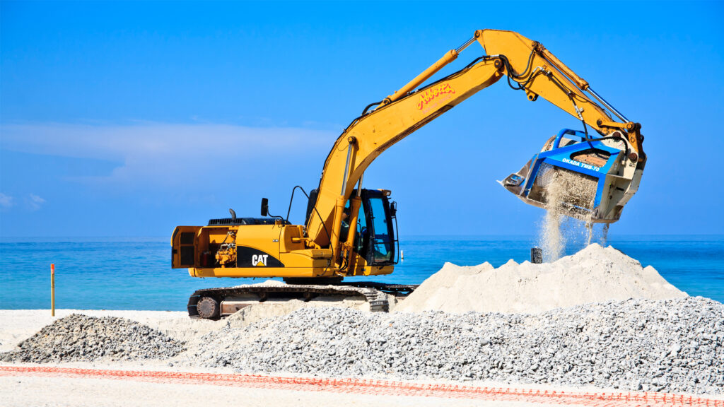 Heavy equipment filters rock from sand as part of a beach renourishment project on Anna Maria Island. (iStock image)