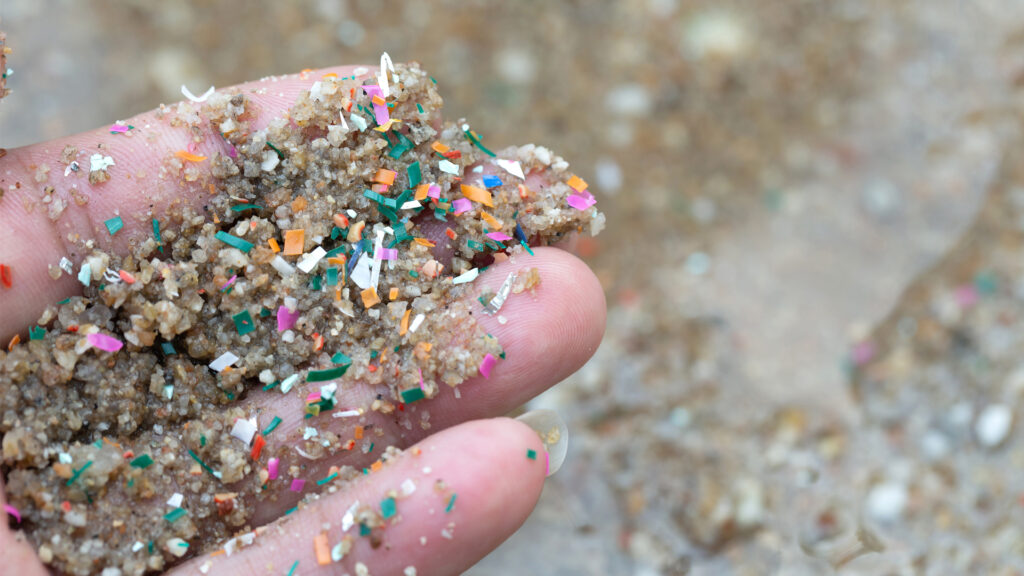 Plastic particles in the sand at a beach (iStock image)
