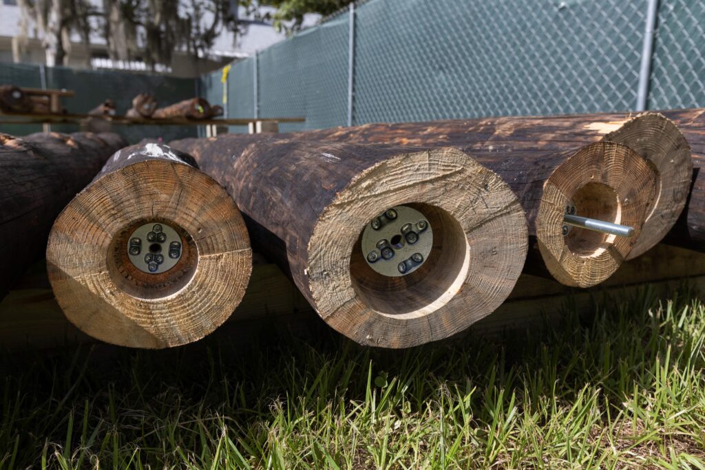 The architects hollowed out the bottom of the logs to support screws that secure them in the ground. (Photo by Tyler Jones, UF/IFAS)