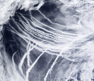 On March 4, 2009, the skies over the northeast Pacific Ocean were streaked with clouds that form around the particles in ship exhaust. (NASA/MODIS Rapid Response Team)