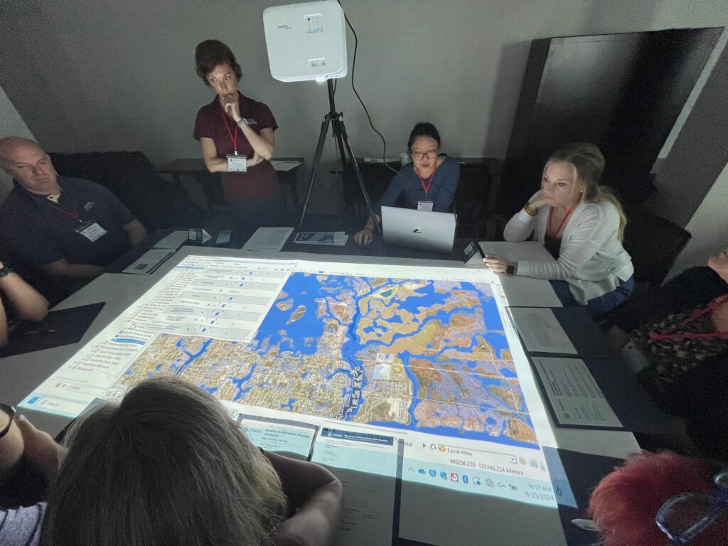 Extension specialists from Texas A&M lead a group of stakeholders in Bay County through a CHARM mapping exercise. (Photo credit: Carrie Stevenson, UF/IFAS Extension)