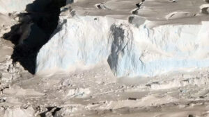 The front of Thwaites’ floating ice shelf is over 200 feet (60 meters) tall in places. (It becomes higher closer to land. James Yungel/NASA Icebridge 2012)