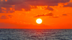 The sun rises over the ocean (iStock image)