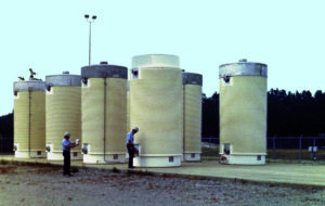 The United States does not have a licensed long-term disposal site for spent nuclear fuel, so it is stored in large dry casks on-site at operating and closed reactors. (U.S. Nuclear Regulatory Commission, CC BY)