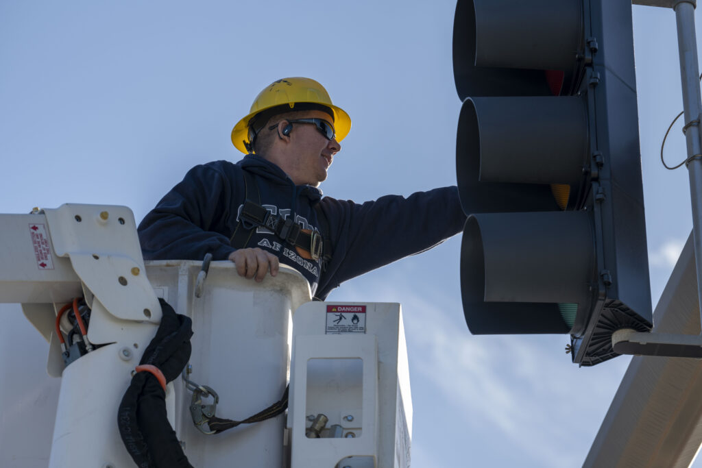 Ricky Martinez, 6th Civil Engineer Squadron high voltage electrician, repairs a stoplight damaged by Hurricane Milton at MacDill Air Force Base on Oct. 17. (U.S. Air Force photo by Airman Monique Stober, via Defense Visual Information Distribution Service)