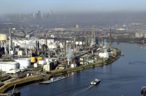 Oil storage tanks and industrial facilities line the Houston Ship Channel, which is vulnerable to storm surge from Gulf of Mexico hurricanes. (United States Coast Guard, PA2 James Dillard, Public domain, via Wikimedia Commons)