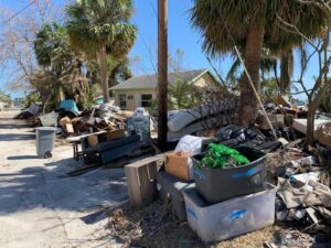 Mounds of debris from Helene and Milton line the streets up and down Madeira Beach, where a barrage of hurricanes have left behind extensive damage. (Ayurella Horn-Muller/Grist)