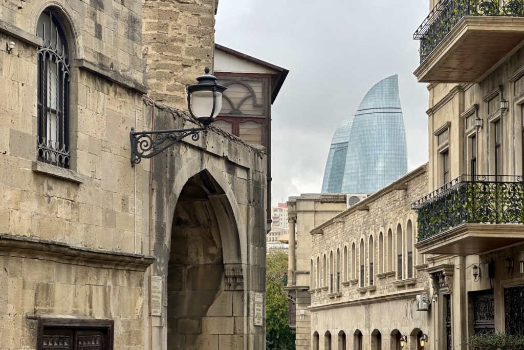 In the shadow of Baku’s three ultra-modern, LED-screen clad, Flame Towers is the old city of Baku. This medieval port fortress town may even date back to the Byzantine-Roman era. Despite being more than 10 years old, two of the three Flame Towers are still unoccupied. These towers owned by the nation's ruling family network are a testament to the country's aspirations to modernity, but its difficult path to achievement. (Photo by Michal Fidler, text by John Capece)