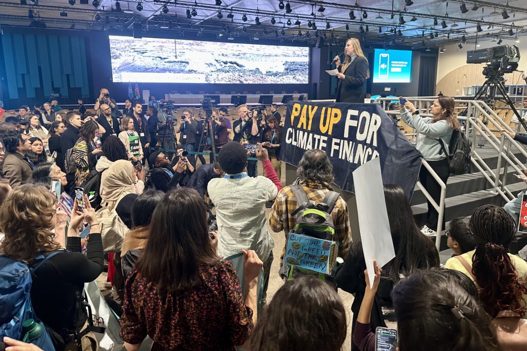 While the wide avenues of Madrid were choked with hundreds of thousands of protestors demanding climate action at COP25 in 2019, protests at COP29 in 2024 are relegated to sections of side rooms where none but the participants can see or hear the desperate appeals. (Photo by Michal Fidler, text by John Capece)