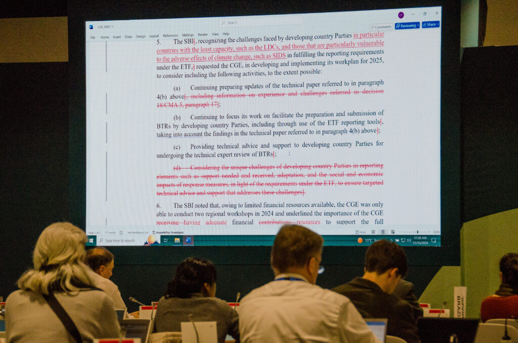 Meanwhile, the tedious work of editing reams of negotiation documents to reach the lowest common denominator language continues in dozens of separate meeting rooms – documents that will add to the mountains from previous years. There is no certainty that any of the words they contain will be sufficient or even implemented. We await the final outcome expected at the end of the week. A second photo essay submitted then will hopefully reflect progress and hope. (Photo by Michal Fidler, text by John Capece)