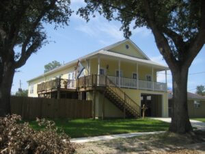 After Hurricane Katrina in 2005, many Louisiana homes were rebuilt with the living space on the second story, with garage space below, to try to protect the home from future flooding. (Infrogmation of New Orleans via Wikimedia, CC BY-SA)