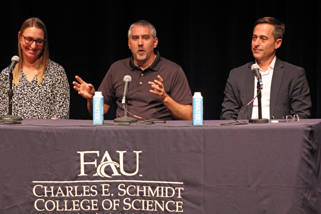 Nick Aumen (center), regional science advisor for the U.S. Geological Survey, speaks during panel discussion on Everglades restoration held Nov. 12 at FAU. (Photo courtesy of Zach Greathouse/FAU)