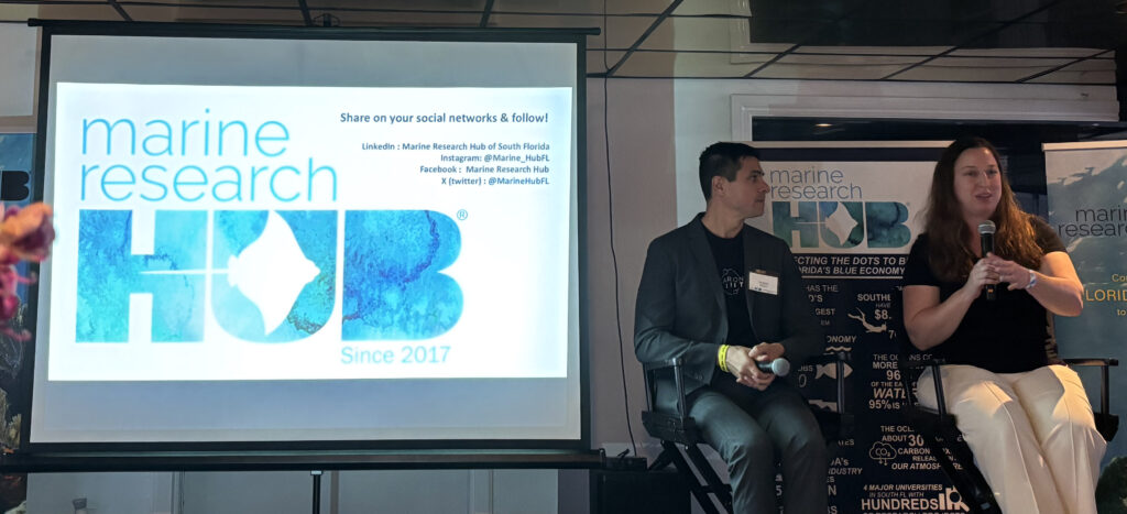 Cordelia Biosciences CEO Jessica Tittl Nielsen speaks at the 8th Annual Marine Research Hub Summit as Carbon Limit CEO Tim Sperry listens. (Laurie Mermet photo)