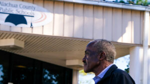 John “Ronnie” Nix stands in front of the Alachua County Public Schools administrative office building, where he worked as an energy conservation specialist. (Sachi Kitajima Mulkey/Grist)