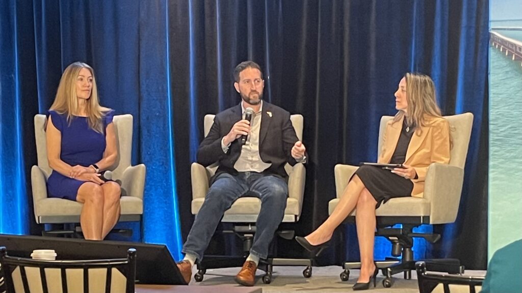 Florida Chief Resilience Officer Wes Brooks (center) speaks at the 16th Annual Southeast Florida Regional Climate Leadership Summit in Key West, in a discussion with Alex Reed, director of the Florida Department of Environmental Protection’s Office of Resilience and Coastal Protection (left), and Patricia Gómez, Miami-Dade County’s interim chief resilience officer (right). (Nathan Crabbe photo)