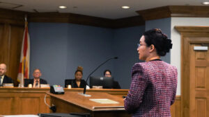 Dan Zhu, Gainesville’s chief resilience officer, presents an update to the Gainesville Climate Action Plan to the City Commission in November. (Sachi Kitajima Mulkey/Grist)