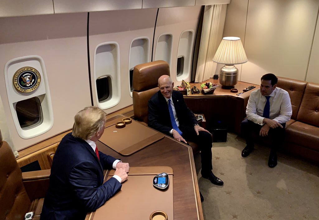 President Donald Trump speaks with U.S. Sens. Rick Scott and Marco Rubio of Florida aboard Air Force One in 2019. (Donald J. Trump, Public domain, via Wikimedia Commons)