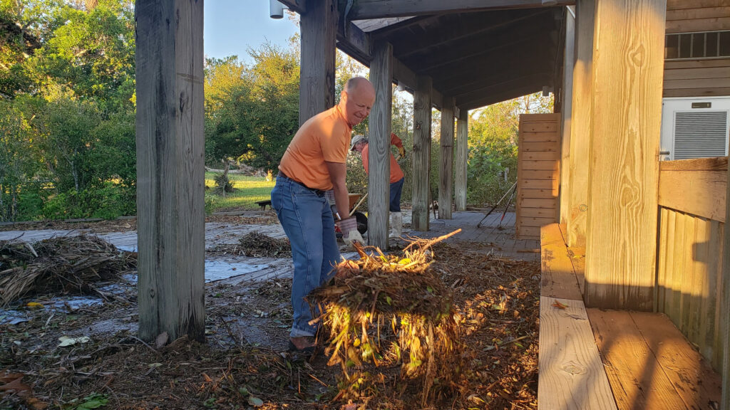 Volunteer Jim Vonasek helped with cleanup efforts after storm surge from Hurricane Milton flooded the Randell Research Center's visitor center. (Florida Museum photo by Michelle LeFebvre)