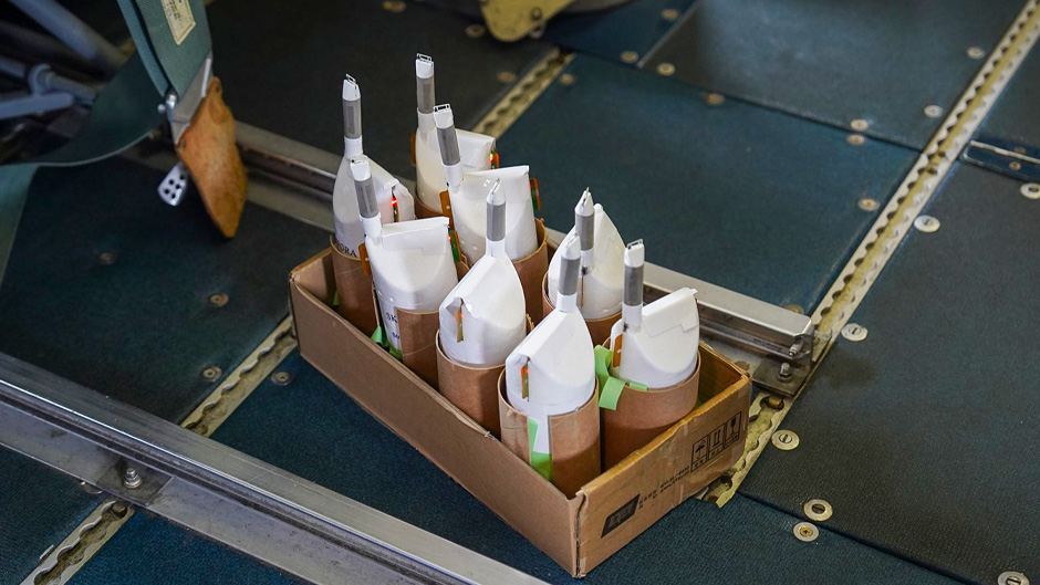 StreamSondes sit in a box prior to being deployed from the bottom of a NOAA P3-Orion Hurricane Hunter aircraft. (Photo: Courtesy of NOAA)