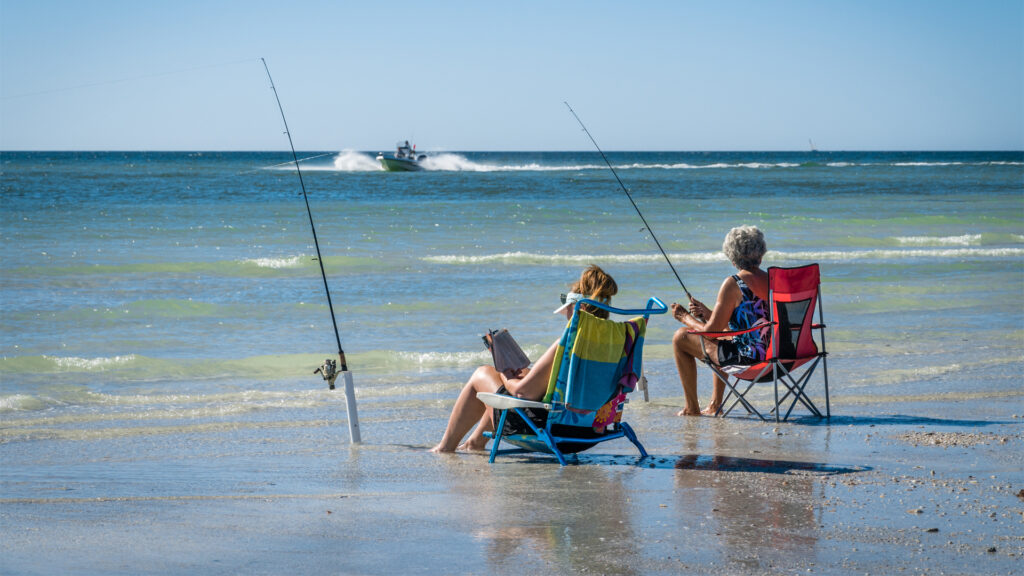 Two women fishing on a Sarasota beach (iStock image)