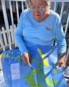 Mayor Sue Colson holds a map of Cedar Key. (Credit: Amy Green/Inside Climate News)