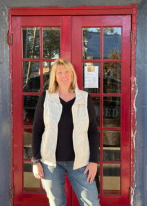 Caryn Stephenson is engaged in multiple businesses in Cedar Key, including two gift shops. The shops reopened within weeks after Helene. Now the problem is customers, she said. (Credit: Amy Green/Inside Climate News)